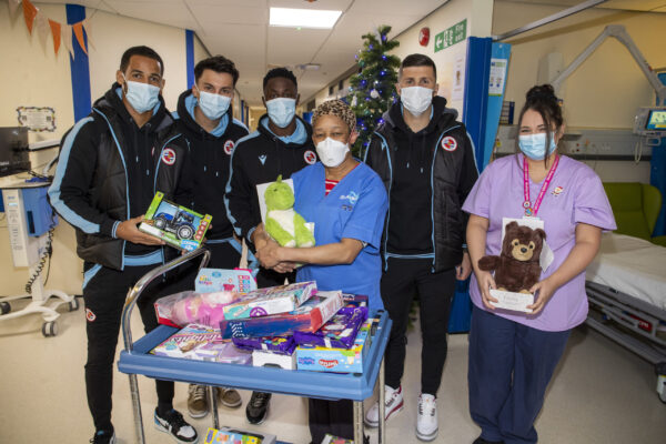 Reading FC players and staff hand out gifts while they visit the childrens ward at The Royal Berkshire Hospital in Reading.