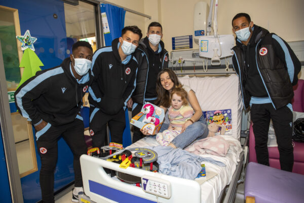 Reading FC players and staff hand out gifts while they visit the childrens ward at The Royal Berkshire Hospital in Reading.
